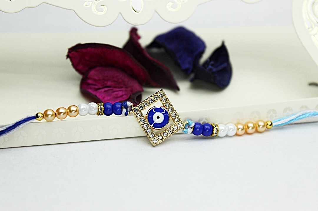 Untitled (12) Jack and Rex Diamond Evil Eye Rakhi with CZ Stones – Blue Beaded Raksha Bandhan Thread for Brother