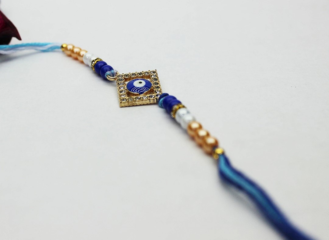 Untitled (14) Jack and Rex Diamond Evil Eye Rakhi with CZ Stones – Blue Beaded Raksha Bandhan Thread for Brother