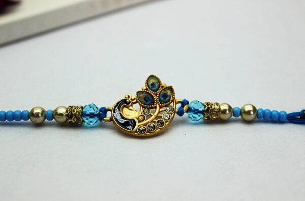 Jack and Rex Peacock Rakhi for Brother – Blue CZ Stone Beaded Raksha Bandhan Thread with Enamel Detailing Jack and Rex Peacock Rakhi for Brother – Blue CZ Stone Beaded Raksha Bandhan Thread with Enamel Detailing