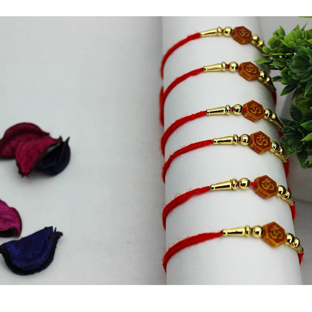 Designer red thread rakhi combo set for Raksha Bandhan Premium Om Rakhi Set of 6 with red thread and golden beads